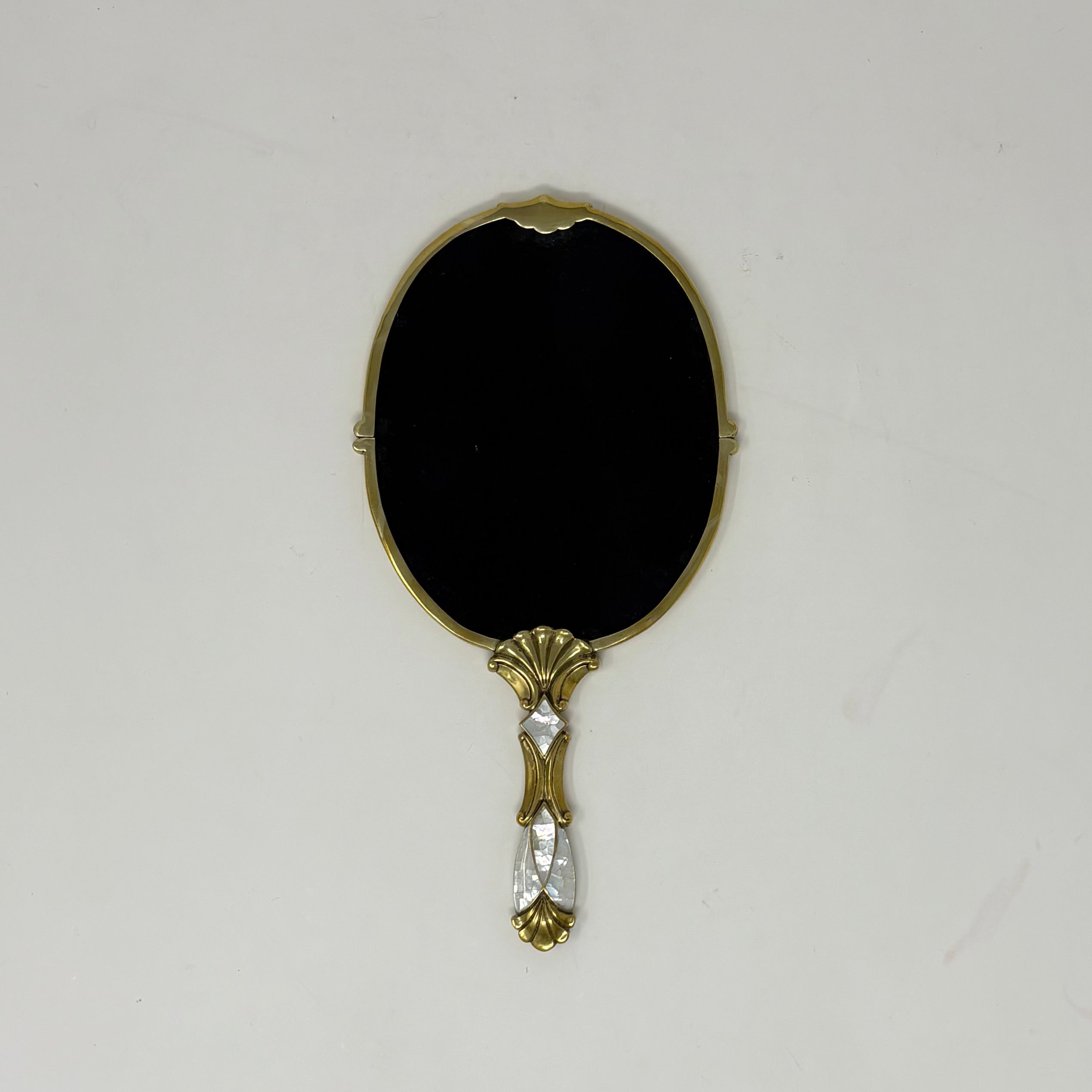 Brass and White Mother of Pearl Inlay Handheld Oval Mirror 4 3/4"w. x 9 1/2" l.
